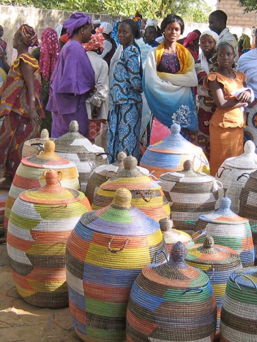 <img src="prayer mat basket.jpg" alt="African Woven Baskets for Sale at Market">